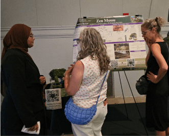 Women looking at science boards